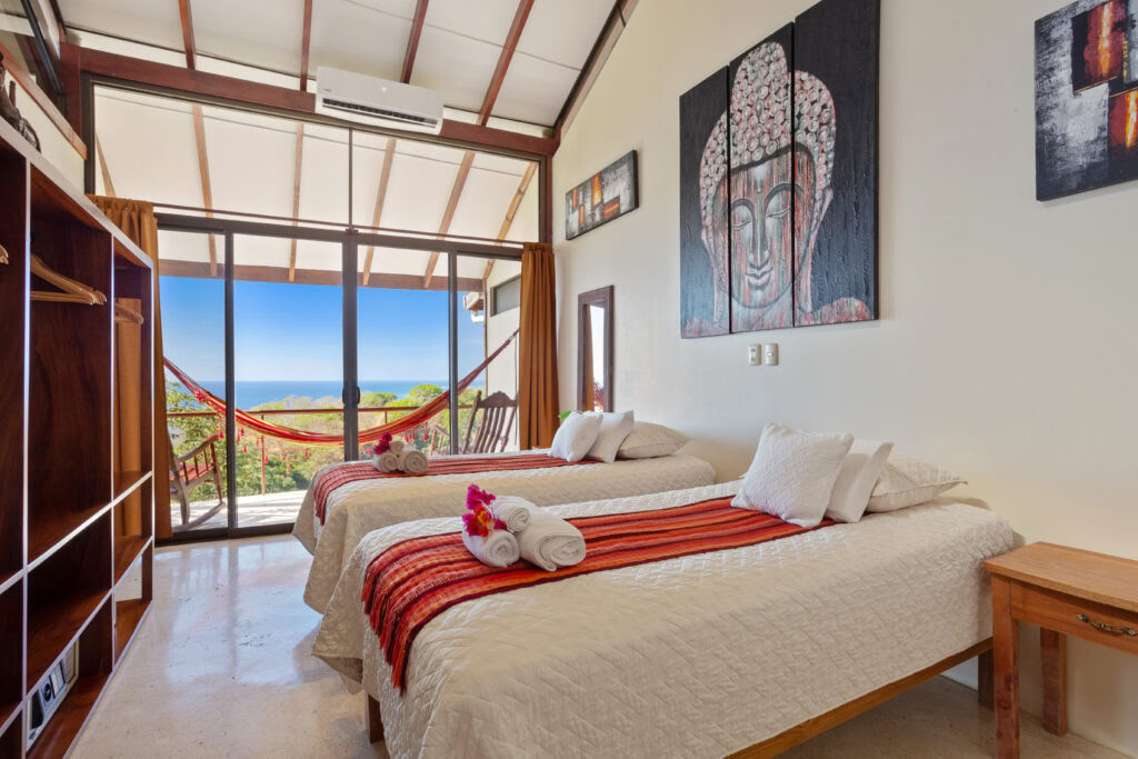 Hanuman Room, by bed